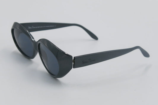 Black sunglasses on a light gray background