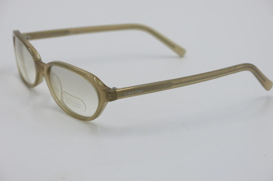 A pair of semi-transparent light brown eyeglass frames with clear lenses, shown on a plain white background.