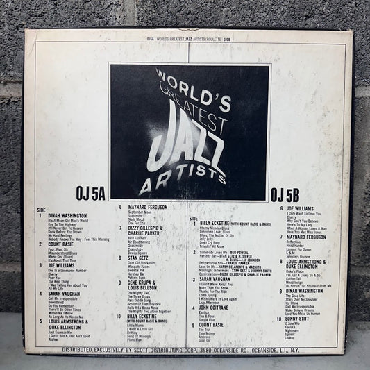 Vinyl record album cover for 'World's Greatest Jazz Artists' by DJJ 5A and 5B, featuring a black central title block and a white tracklist layout on a worn off-white background, photographed against a gray textured wall.