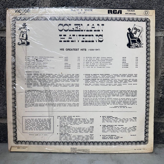 Coleman Hawkins 'His Greatest Hits (1939-1947)' vinyl record album cover, sealed in clear plastic shrink wrap, photographed against a dark textured background. The cover is cream-colored with black text and a decorative border, featuring RCA and Victor branding.