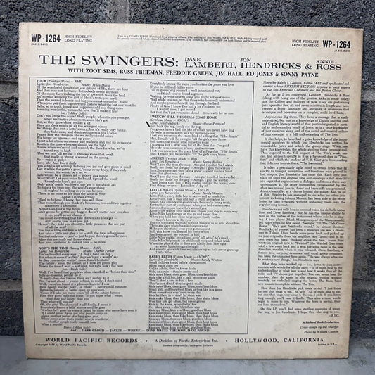 The back cover of a vinyl record sleeve for 'The Swingers' album, featuring extensive track listings, photographed against a dark textured background.
