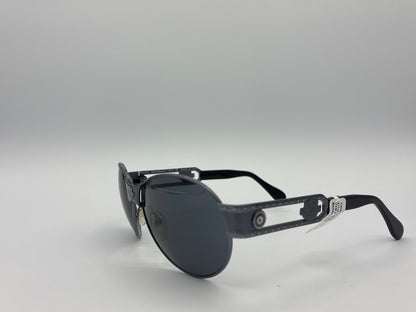 Black sunglasses with reflective lenses on a gray background
