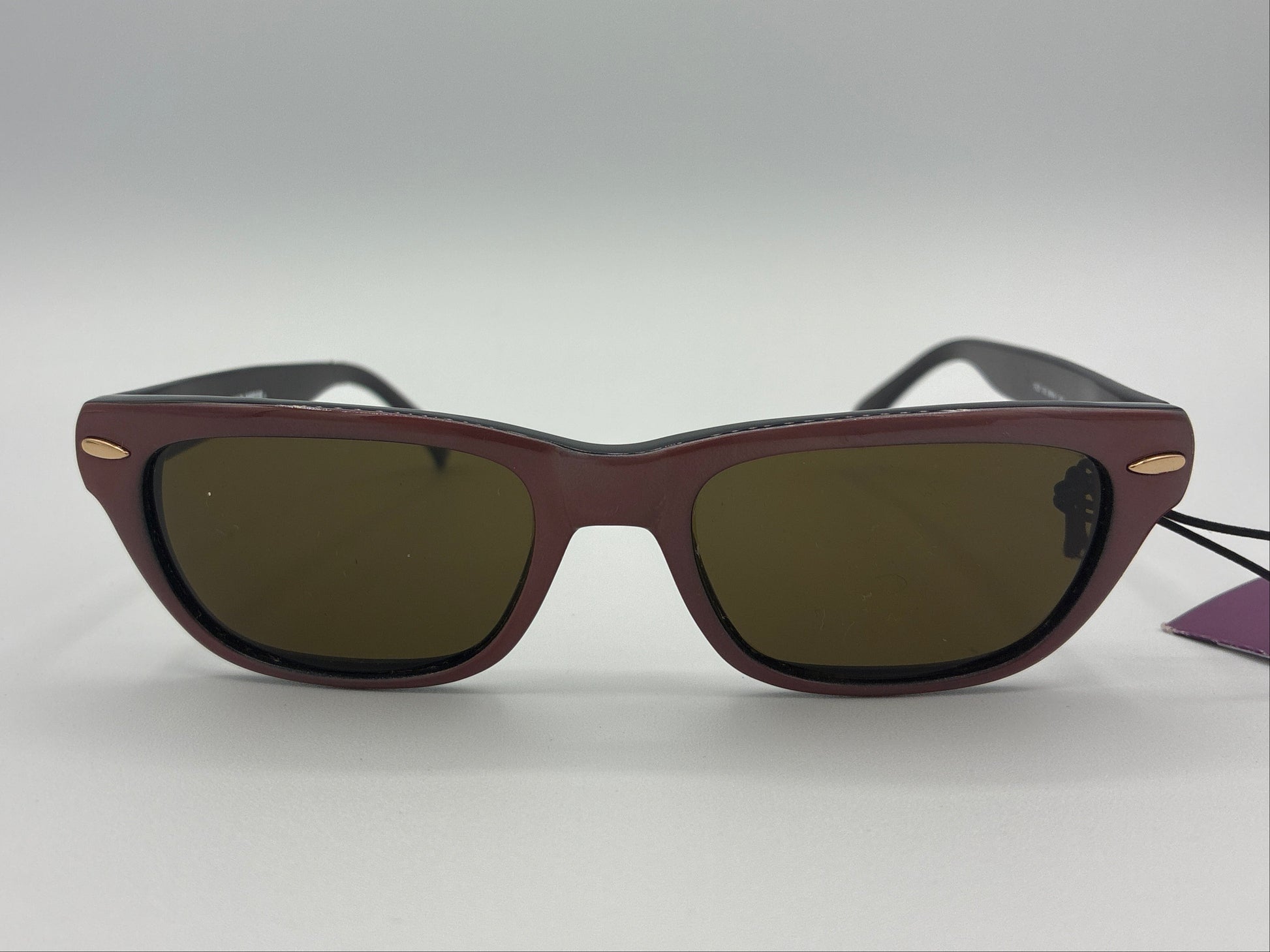 Sunglasses with dark lenses on a white background