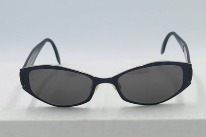 A pair of dark blue Paloma Picasso sunglasses with a case on a white surface.