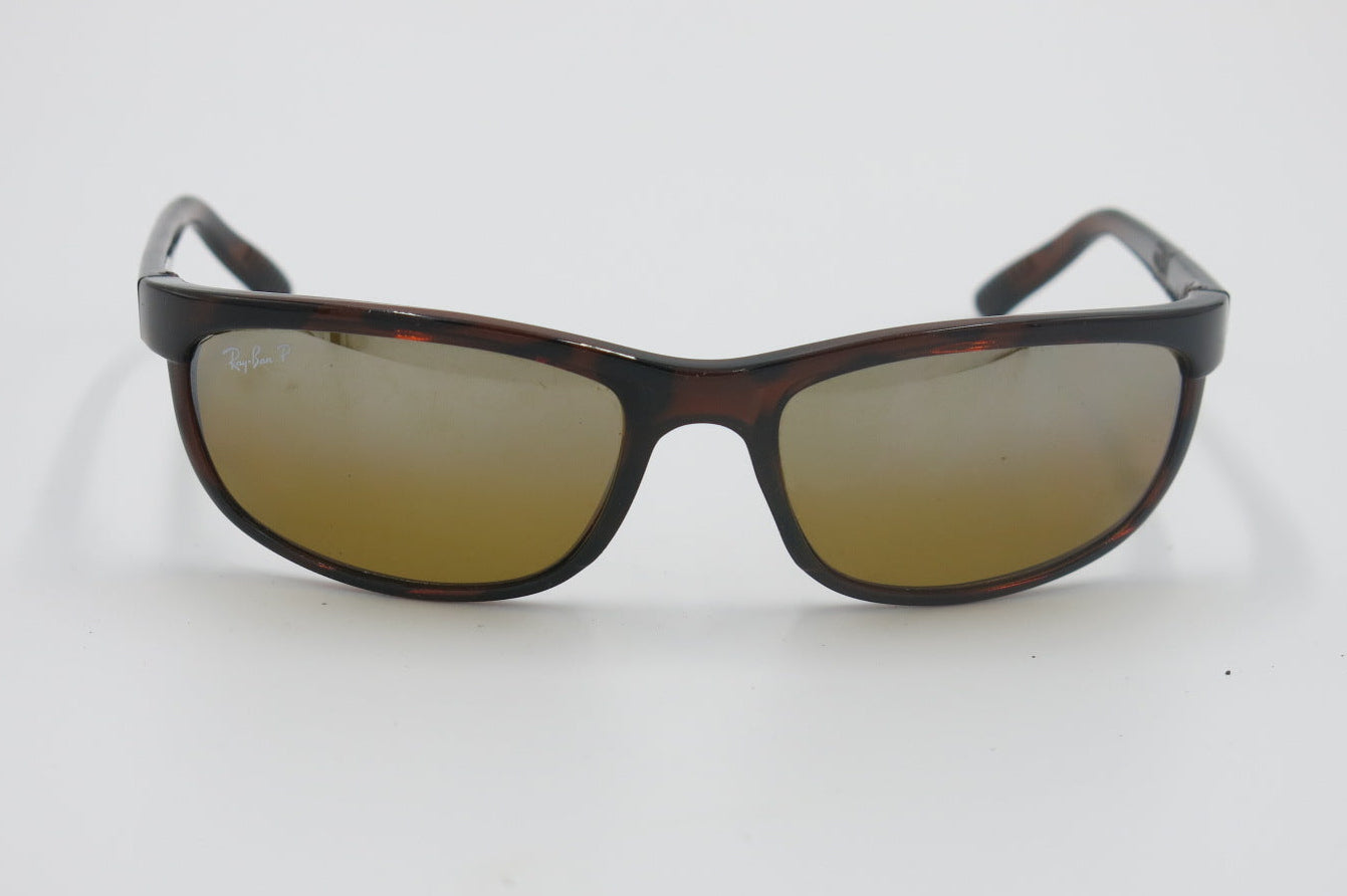 Sunglasses with brown gradient lenses on a white background