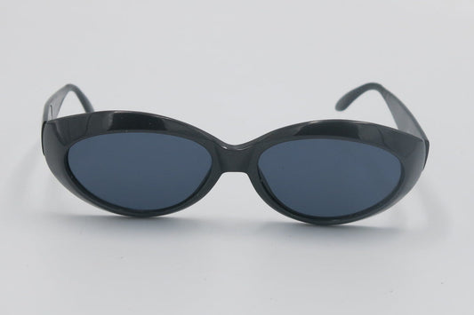 Black sunglasses with oval lenses on a light gray background