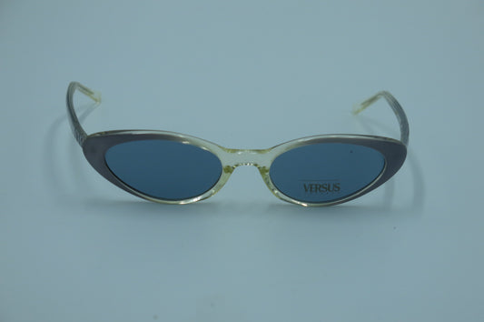 Sunglasses with 'Versus' branding on a light blue background
