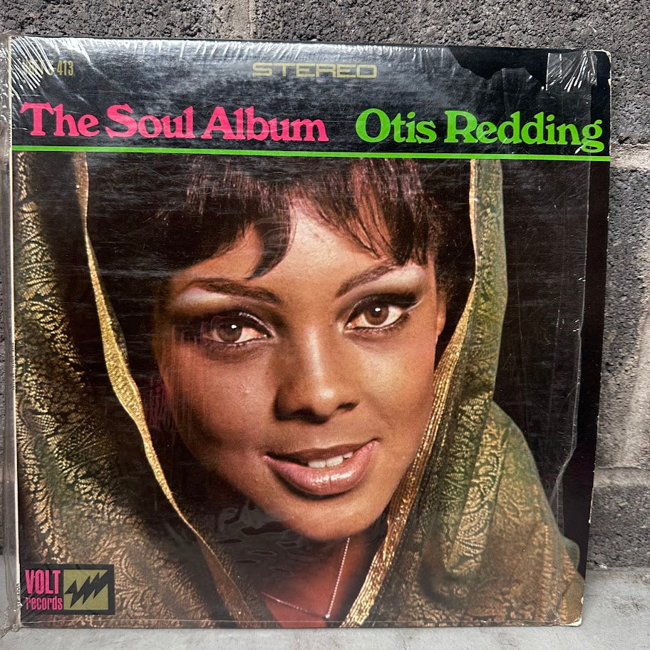 Vinyl record cover of 'The Soul Album' by Otis Redding on a textured surface.