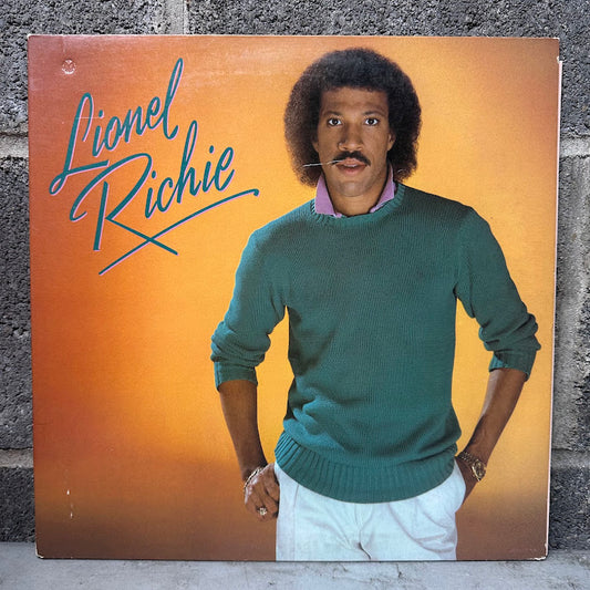 Album cover featuring a man in a green sweater with 'Lionel Richie' text on an orange background.