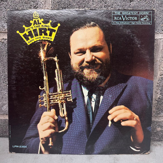 A vintage RCA Victor vinyl record sleeve for Al Hirt and His Band's 'He's the King of the Horn'. The cover features a portrait of Al Hirt in a blue suit holding a gold trumpet against a dark background, with the RCA Victor logo in the top right corner.