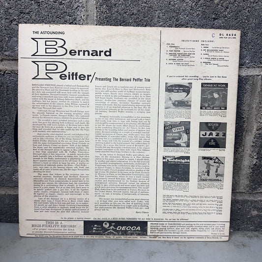 The back cover of a vinyl record sleeve for 'Bernard P. Reifter / Presenting The Bernard Potter Trio' by The Astounding, photographed leaning against a gray concrete block wall.