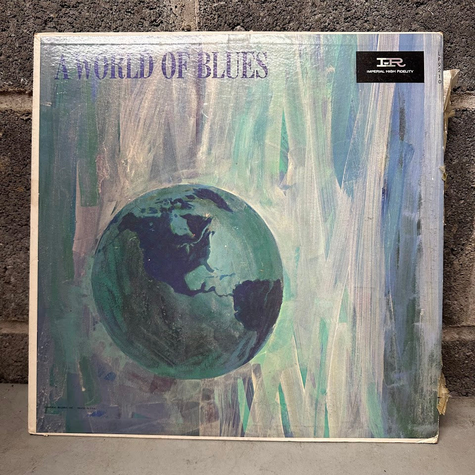 Vinyl record cover titled 'A World of Blues' with a globe illustration on a textured background.