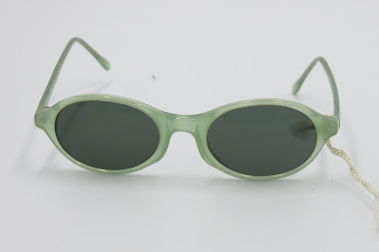 Green sunglasses with a Calvin Klein tag on a white background